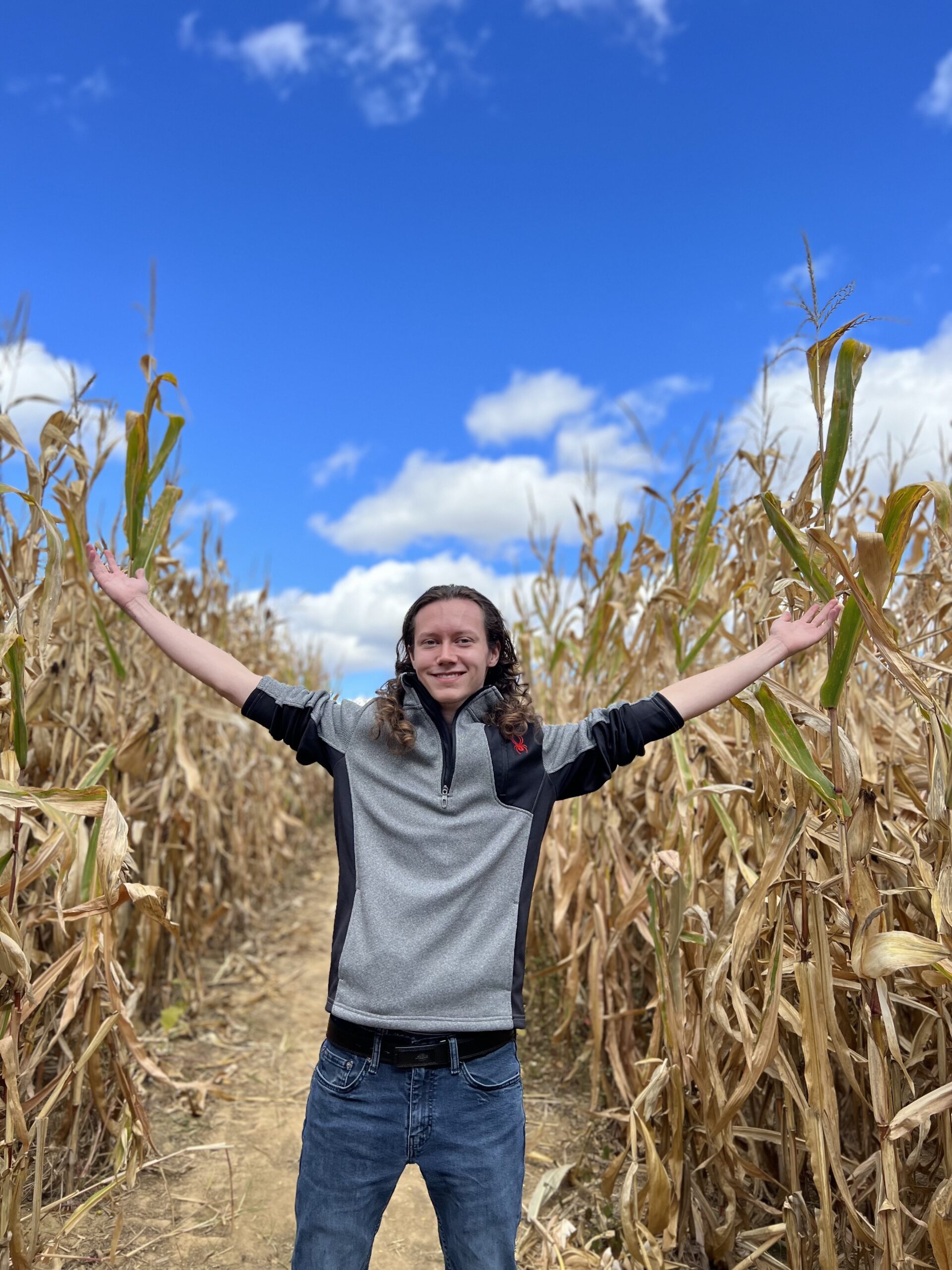 Photo of Jarod Maxwell in a corn maze.