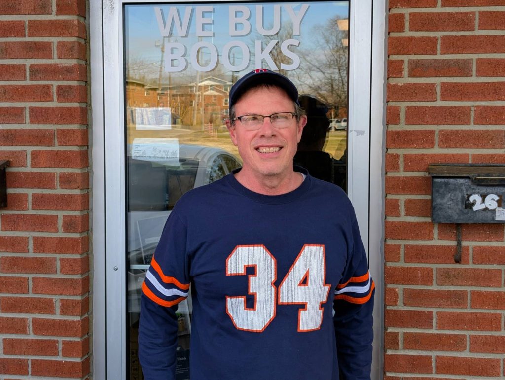 Joe Grant, owner of Academic Scholarly Books, standing outside his store at 223 Pete Ellis Drive in Bloomington, Indiana