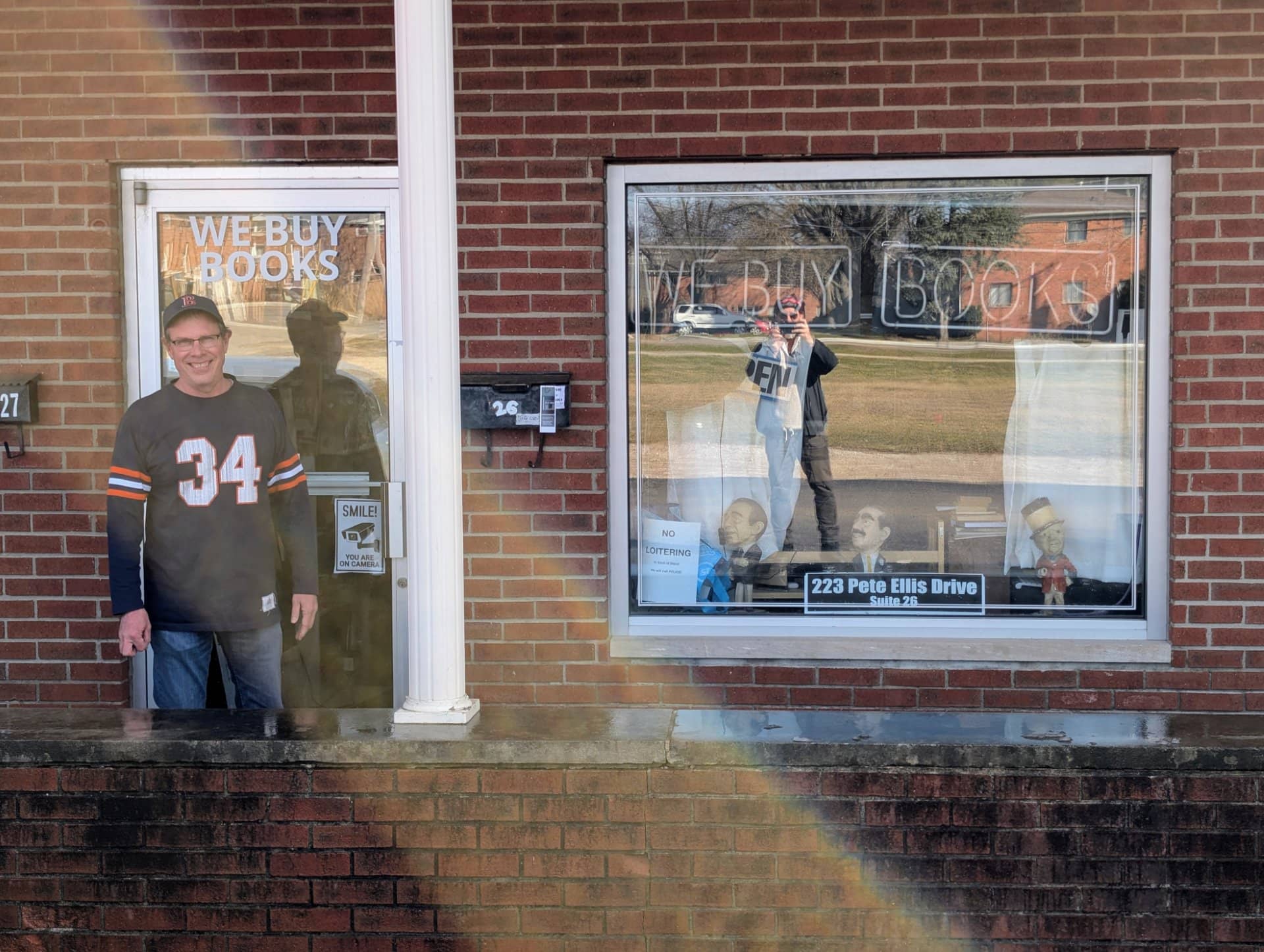 Joe Grant standing in the doorway of Academic Scholarly Books at 223 Pete Ellis Drive in Bloomington, Indiana