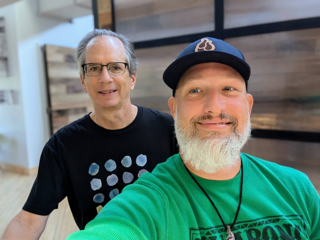 Two men, including Brian Beach, CTO of BackBlaze, posing for a selfie during a meetup at The Mill in Bloomington, discussing cloud backup solutions and web hosting.